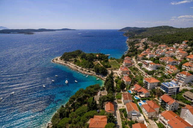 Drone view at Villa Cvita and attractive front bay of Hvar